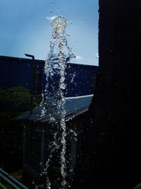 Close-up of water splashing against glass