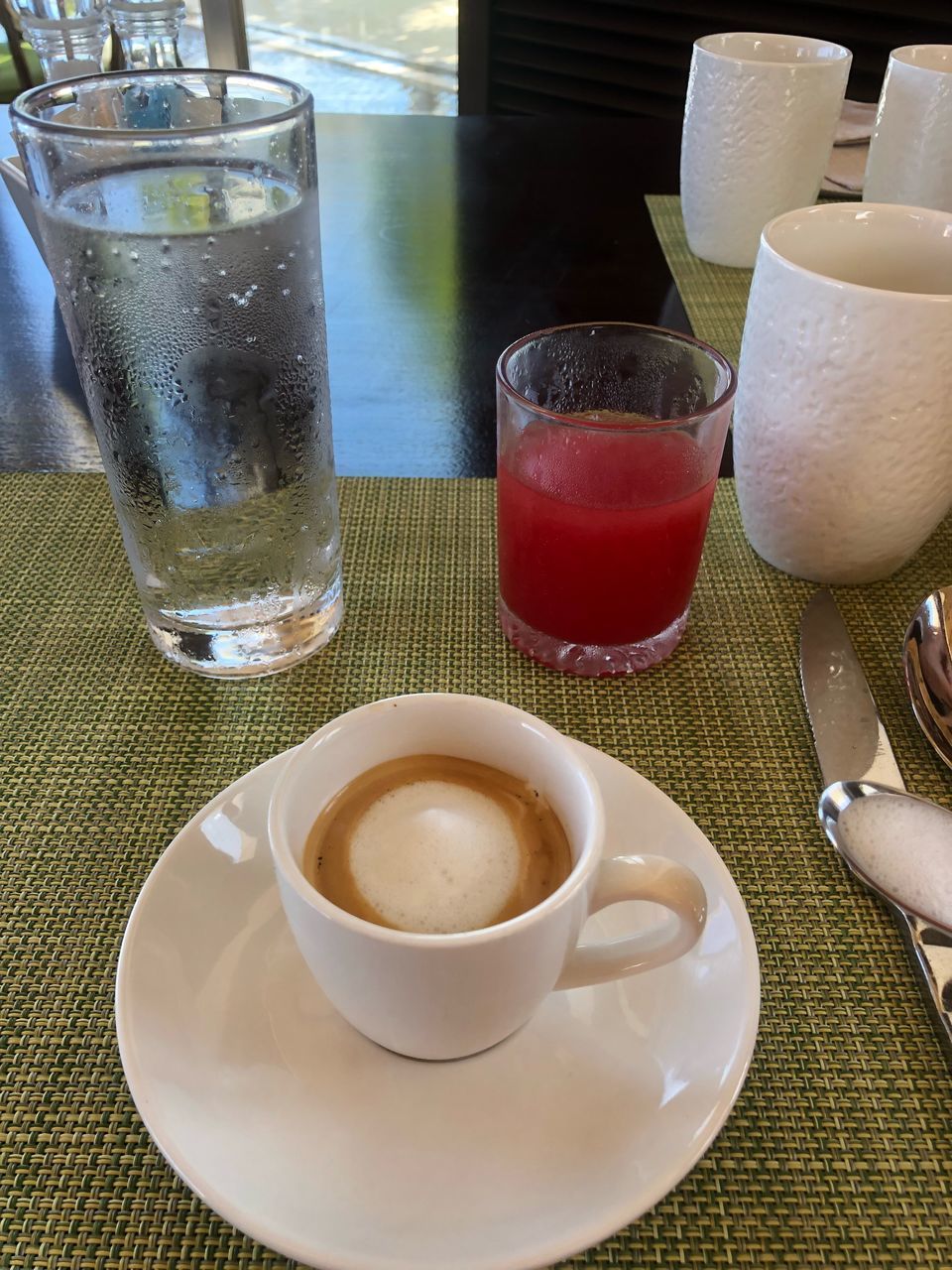 COFFEE CUP AND GLASS ON TABLE