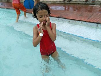 Cute girl in swimming pool