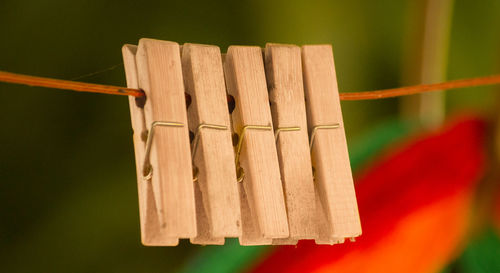 Close-up of rope tied to wooden fence