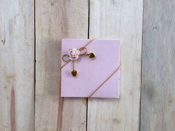 High angle view of envelope on wooden table