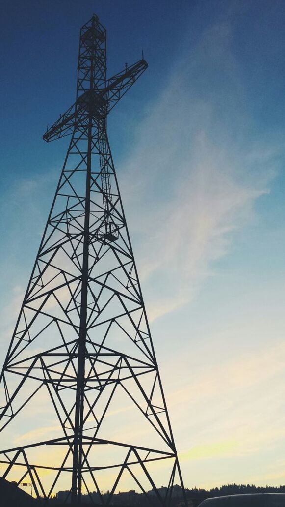 low angle view, fuel and power generation, electricity pylon, silhouette, technology, electricity, power supply, connection, sky, power line, sunset, electricity tower, outdoors, no people, tall - high, nature, dusk, blue, cloud, environmental conservation