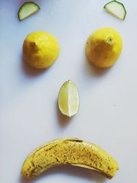 Close-up of fruit over white background