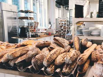 Loaves of bread on table in bakery