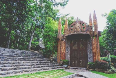 Entrance of temple against building