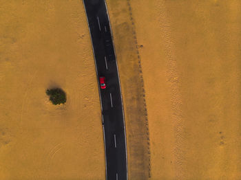 High angle view of yellow car on road