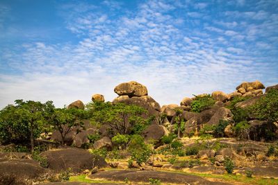 Rock formations on landscape against sky