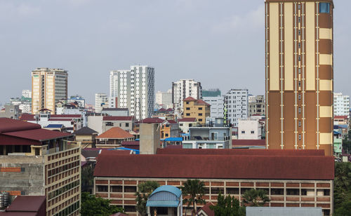 Modern buildings in city against sky