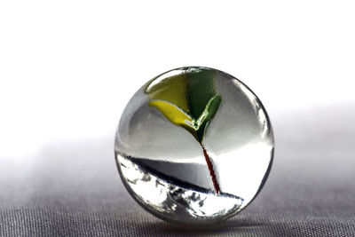 Close-up of glass of ball on table