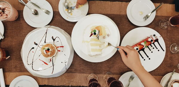 Directly above shot of woman preparing food on table