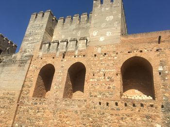 Low angle view of historical building against clear sky