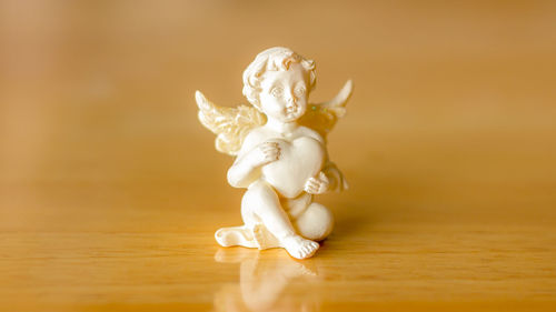 Close-up of figurine on table