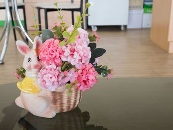 Close-up of pink flower pot on table