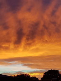 Low angle view of dramatic sky during sunset