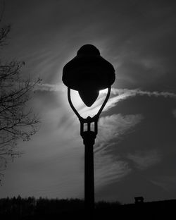 Low angle view of street light against sky at sunset