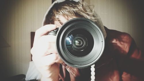 Man photographing with slr camera