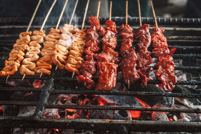 High angle view of meat on barbecue grill