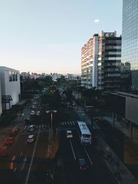 High angle view of city street and buildings against sky