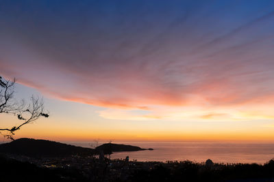 Scenic view of sea against orange sky