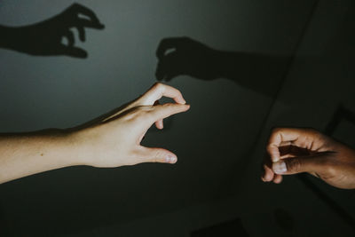 Close-up of woman hand with shadow