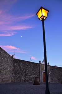 Low angle view of street light against sky