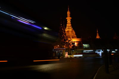 Illuminated cathedral against sky at night