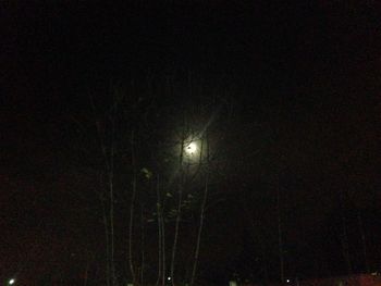 Low angle view of illuminated lights at night