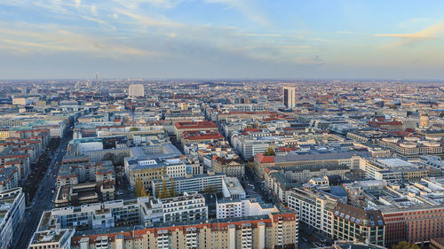 Aerial view of cityscape against sky