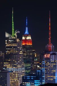 Illuminated buildings in city at night