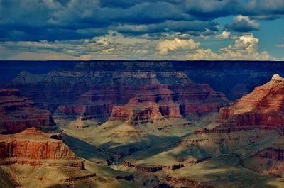 Scenic view of mountains against cloudy sky