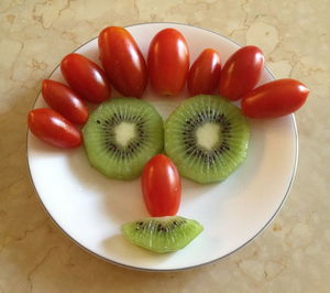 High angle view of fruits in plate on table