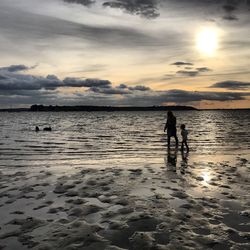 Scenic view of sea against sky at sunset