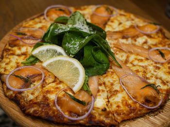 Close-up of pizza served on table