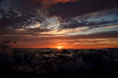 Scenic view of beach against sky during sunset