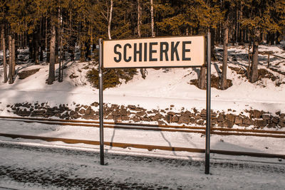 Information sign on snow covered road