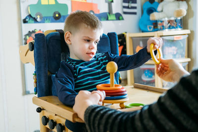 Cute boy playing with toy