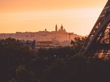 Buildings against sky during sunset