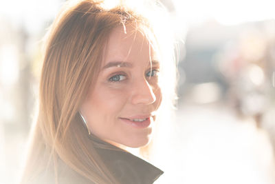 Portrait of smiling young woman outdoors