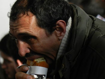 Close-up of man eating food