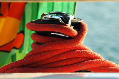 Close-up of red shoes on shore