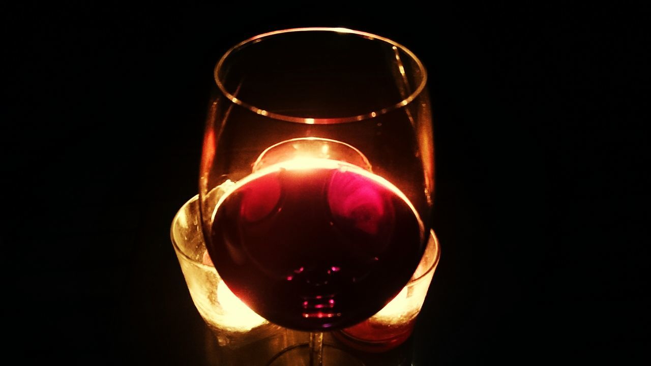 indoors, drink, food and drink, still life, refreshment, studio shot, table, glass - material, drinking glass, close-up, wineglass, transparent, black background, alcohol, glass, freshness, wine, single object, red, no people