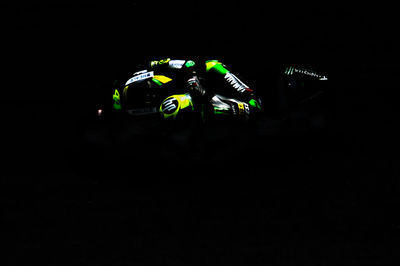 Close-up of camera over black background
