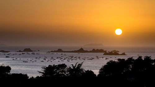 Scenic view of sea against sky during sunset