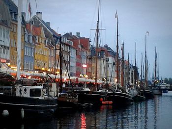 Boats moored at harbor