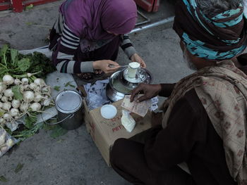 High angle view of woman and ice cream