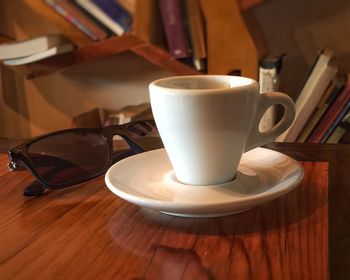 Close-up of coffee cup on table