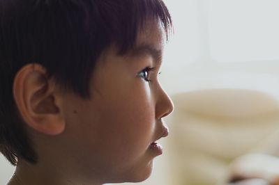 Close-up of boy looking away