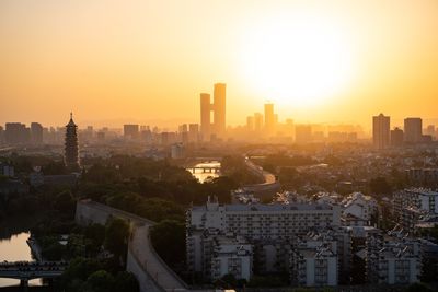 High angle view of buildings against sky during sunset