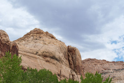 Rock formations on landscape against sky