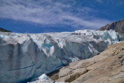 Scenic view of glacier against sky